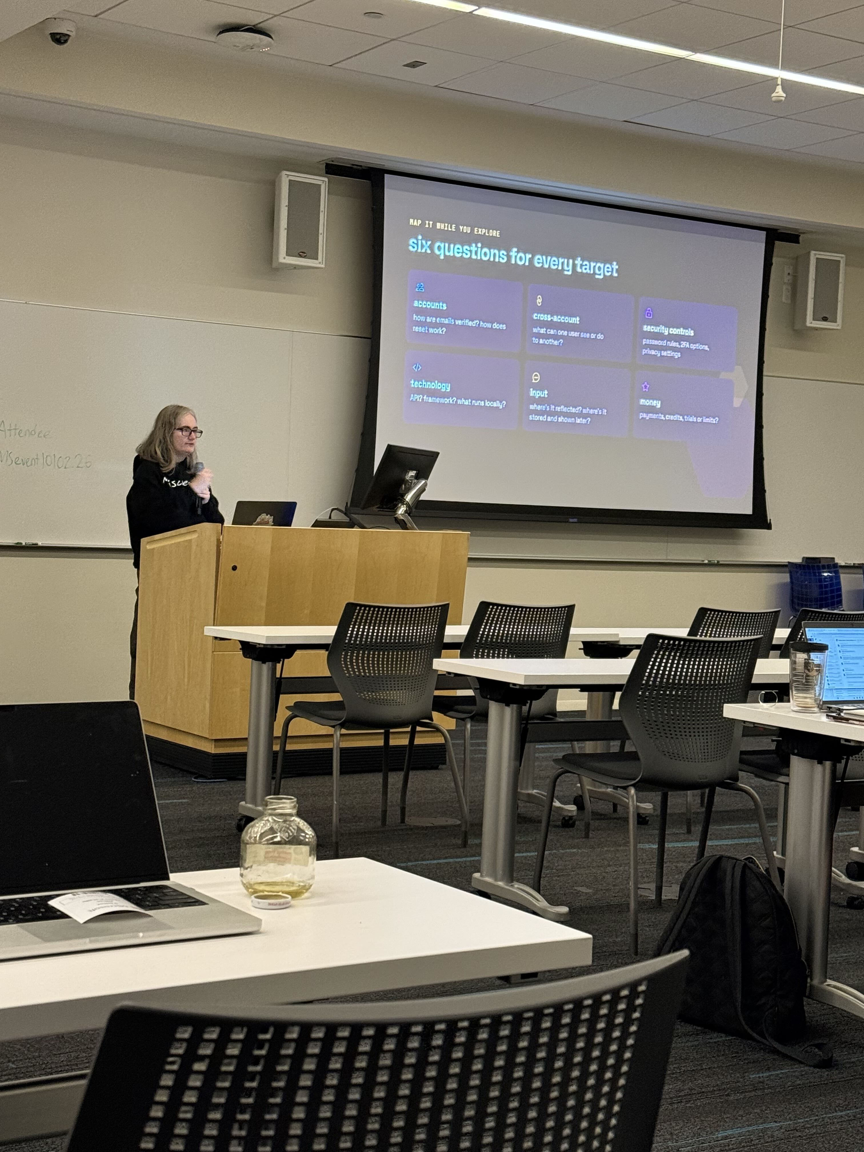 A speaker teaching a technical session at Glass Firewall 2026
